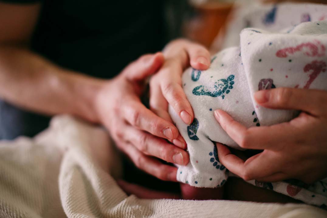 Mother and Father in hospital delivery room awaiting the arrival of their newborn.